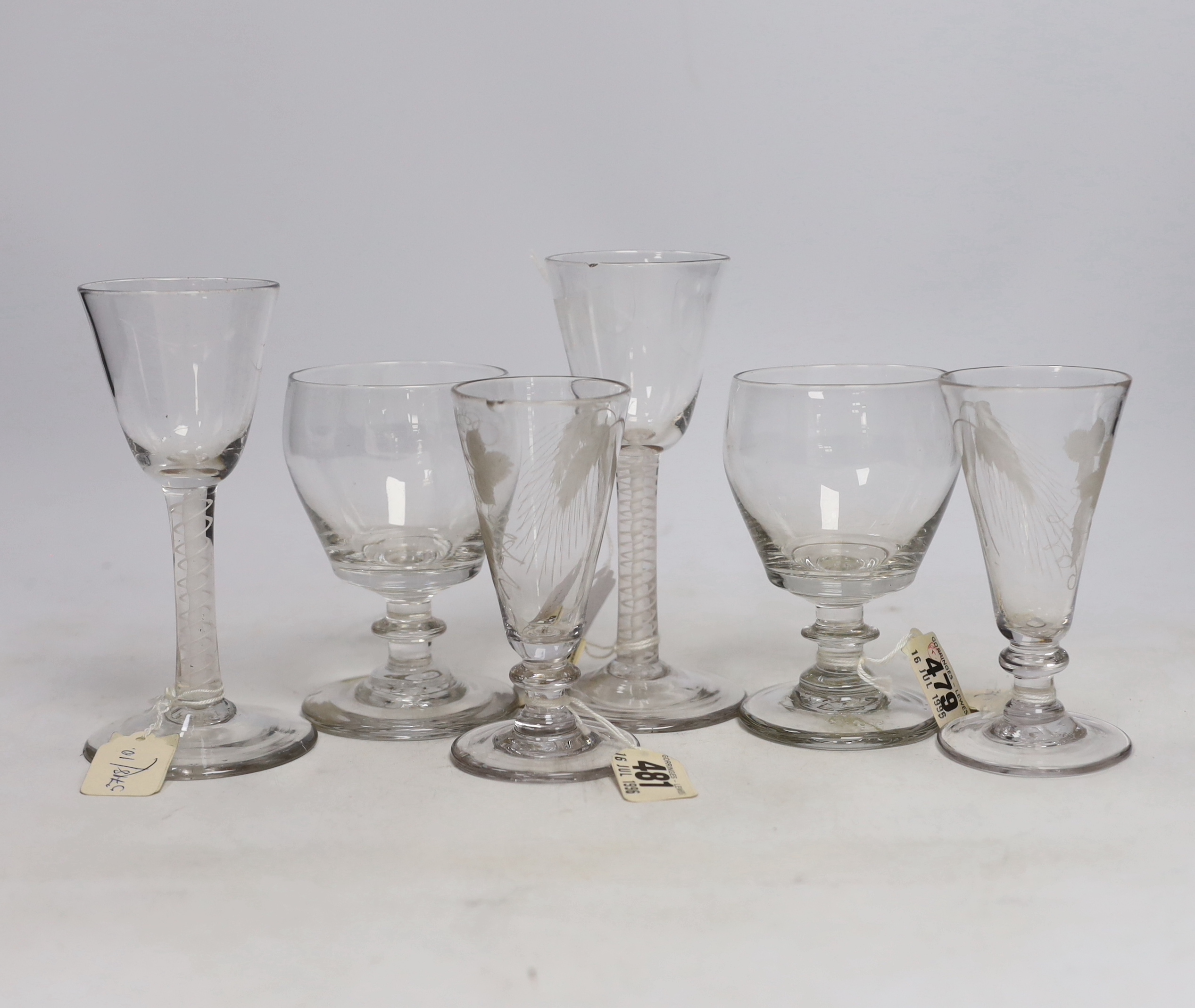 Two late 18th century DSOT Wine glasses, two dwarf ale glasses with engraved hops and barley, and knopped stems, two early 19th century drummers with knopped stems and rough pontils, tallest 16cm (6)